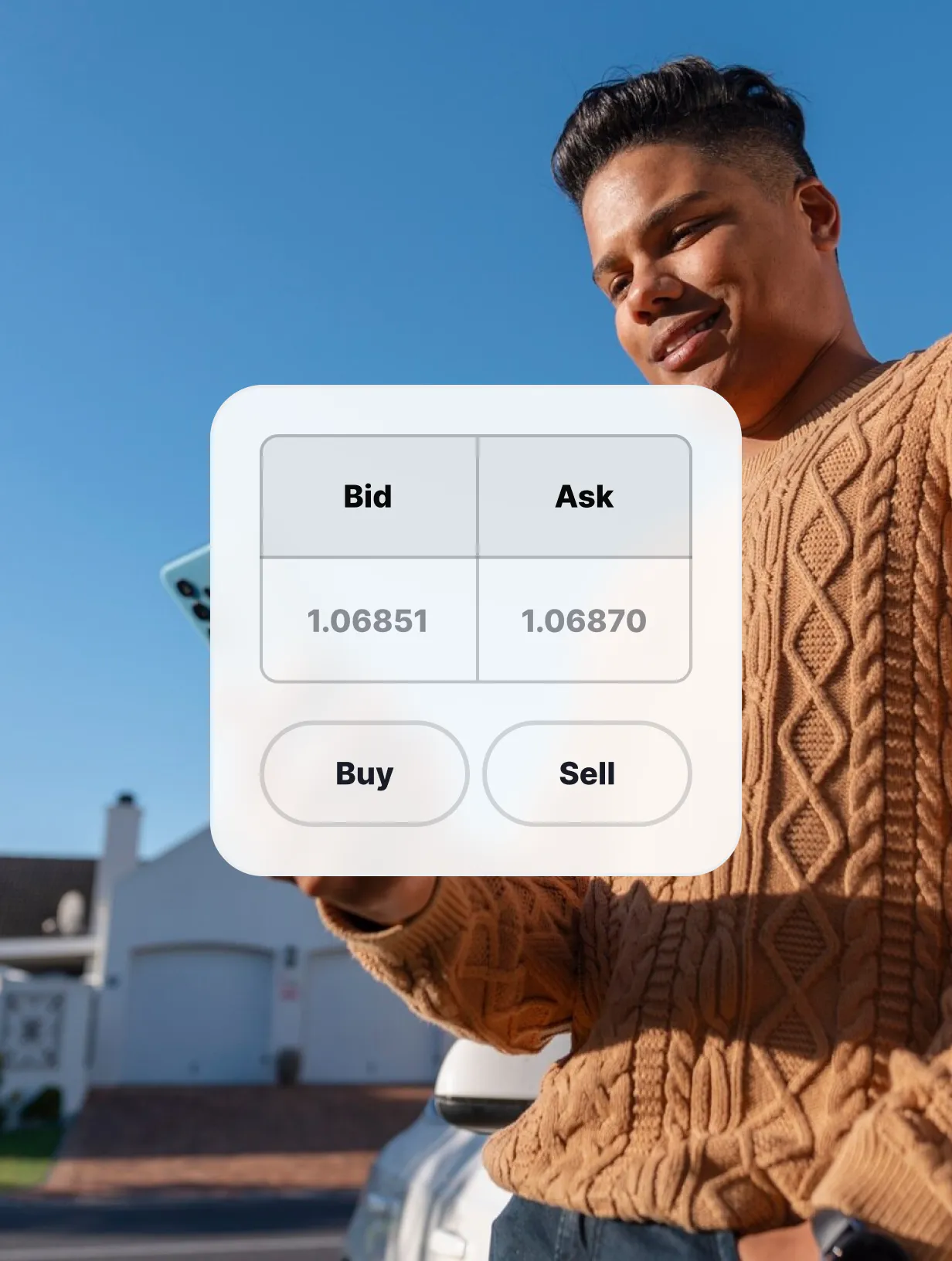 Man trading on a mobile device, displaying a buy and sell interface with bid and ask prices.