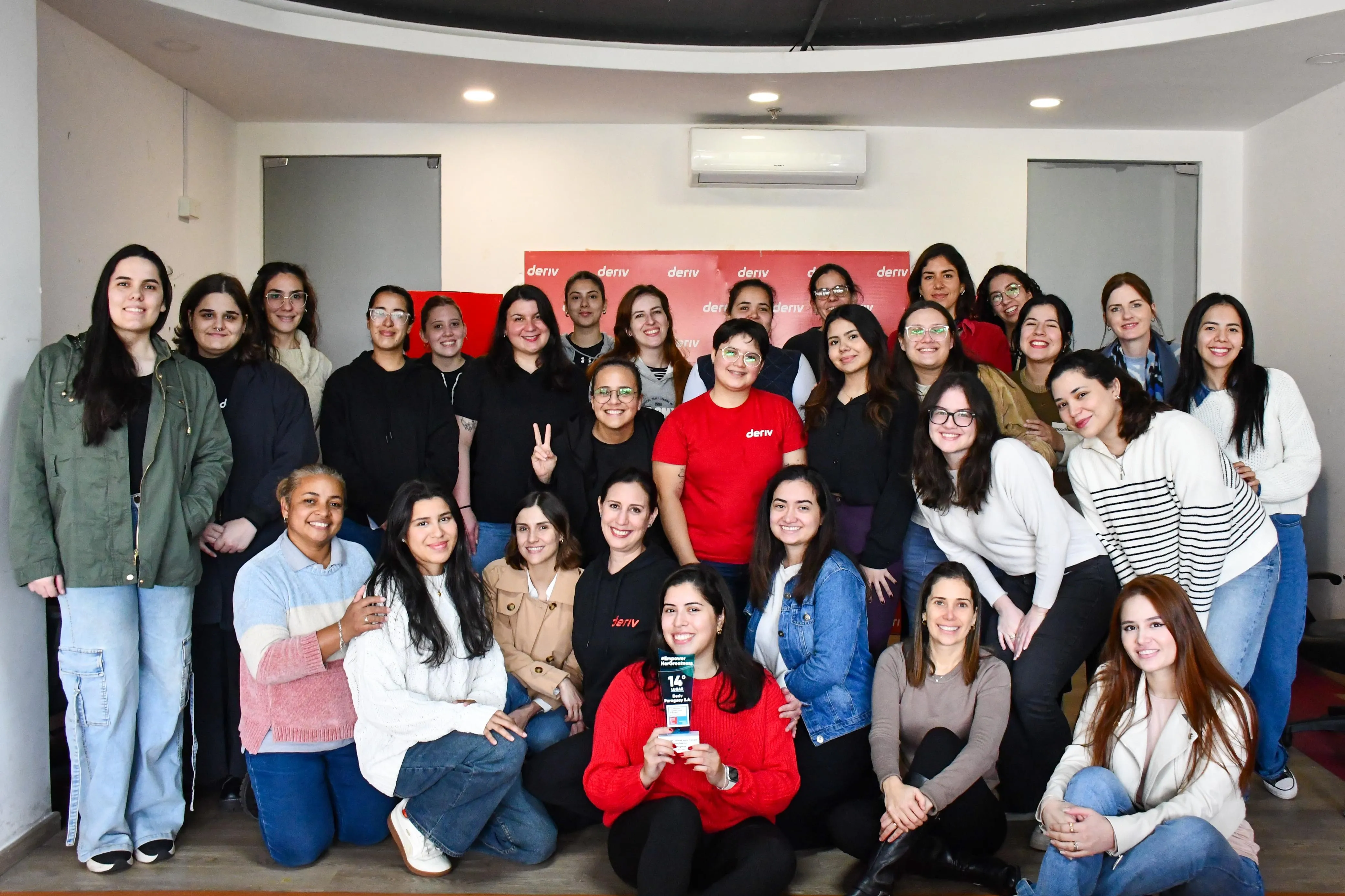 Paraguay team holding the Best workplace for woman award