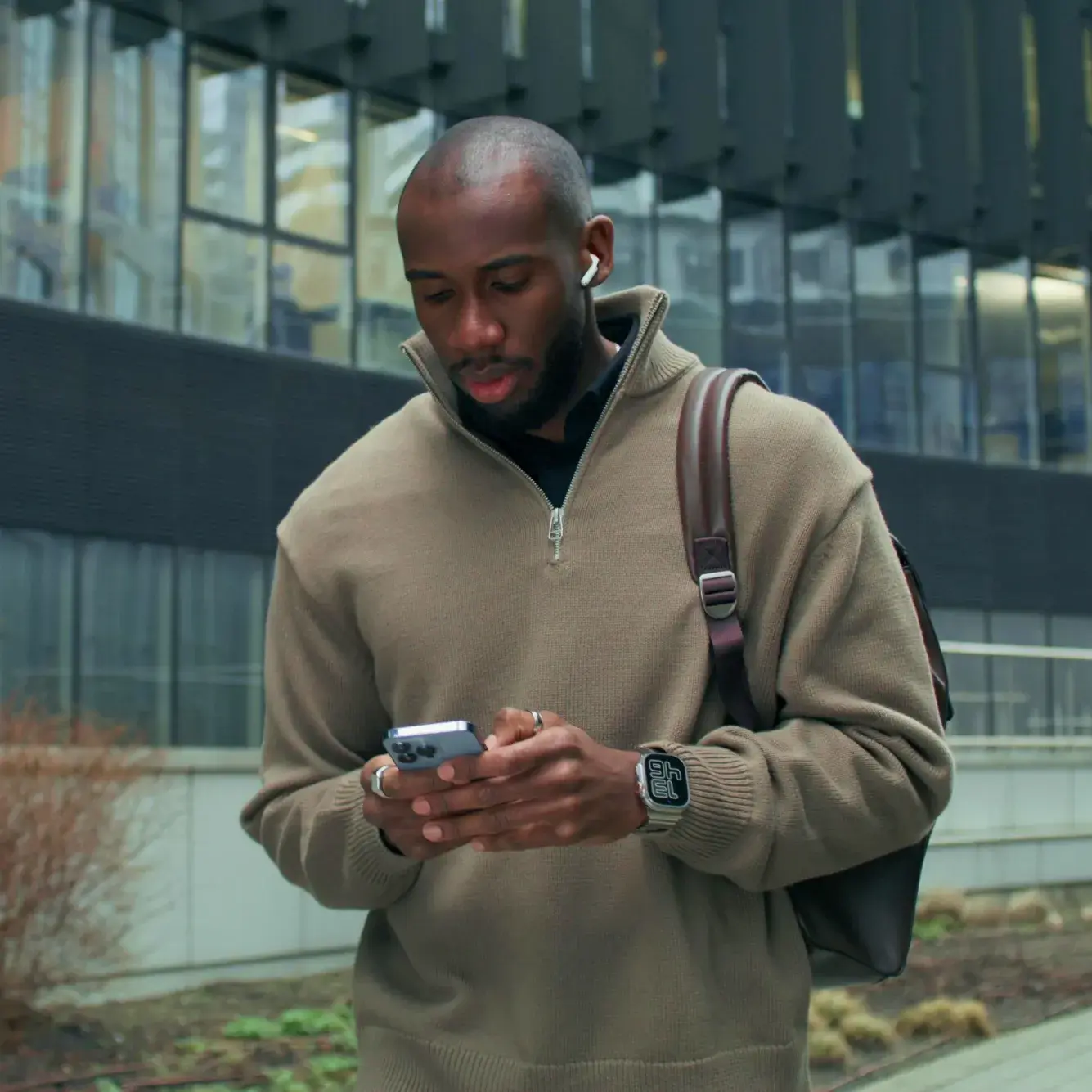 Trader checking Wall Street 30 prices on a mobile trading platform